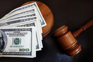 gavel with dollar bills on it